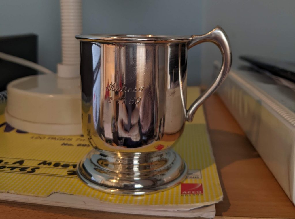 photo of shiny silver christening mug